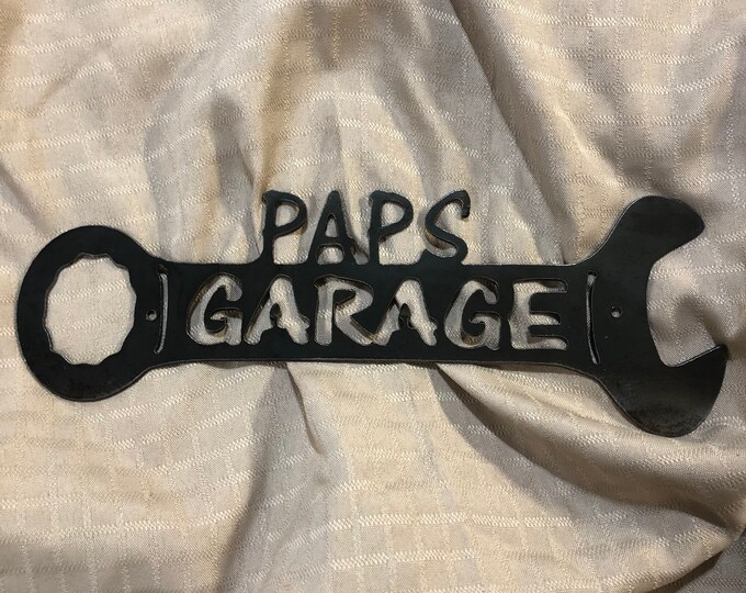 Metal paps garage wrench sign.