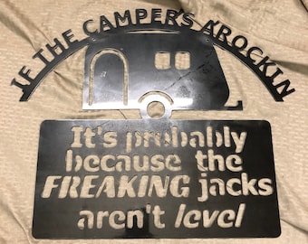 Metal sign ( if the camper’s a’rockin) sign.