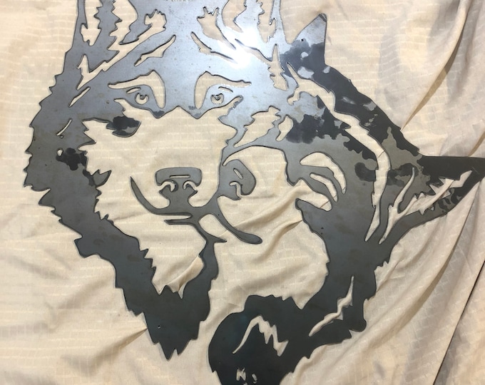 Industrial Rustic Metal Wolves sign. Cut drom 14 gauge steel and clear coated. Available in 24, 30, and 36 inches.