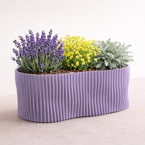 WAVY ovale bloempot, modern geribbeld ontwerp met golvende look, verkrijgbaar in oranje, pistache, kersenbloesem en cappuccino.