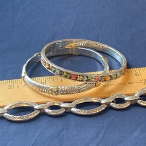 May include: A rustic wooden sign with the text "Welcome to our home" in white lettering. The sign features a distressed finish and a simple, inviting design, perfect for entryway decor.