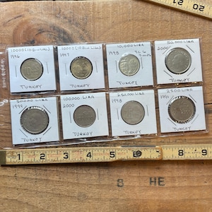 Vintage 8 coin lot Turkey 1990&#39;s  2000 Bin Lira in protective sleeves.