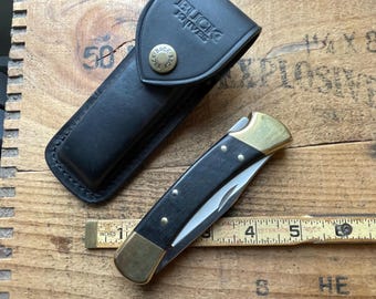 Buck USA model 110 brass Lockback 1 blade pocket knife w/ sheath unused