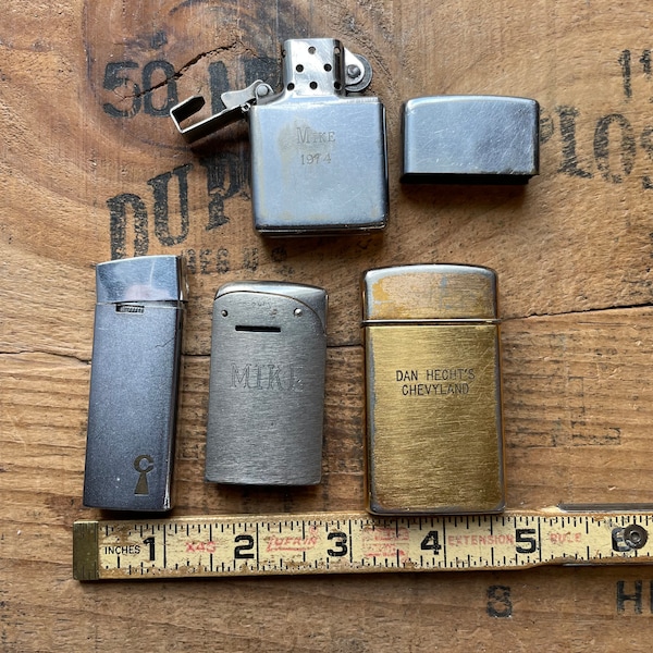 Lot of 4 lighters Zippo, Evans, Avanti and Metro some advertising