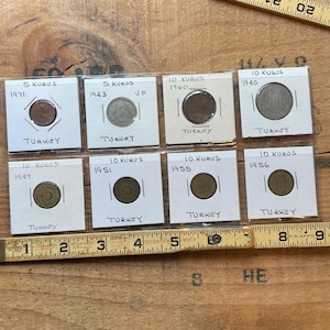 Vintage 8 coin lot Turkey 40's thru 70's in protective sleeves.