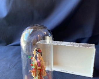 Asian Lady figurine under cloche