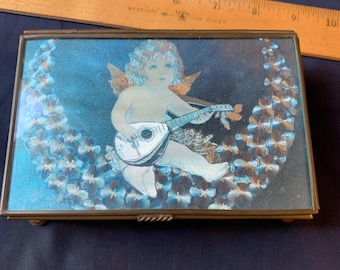 Caja de música vintage de latón con vidrieras