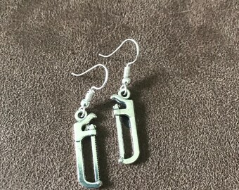 Hack saw charm earrings