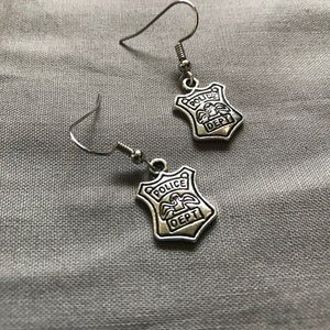 Police charm earrings
