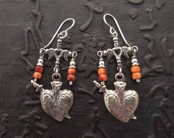 Sterling silver and spiney oyster shell earring of religious medals and milagros hearts Latin American Frida Kahlo Mexico Mexican sacred