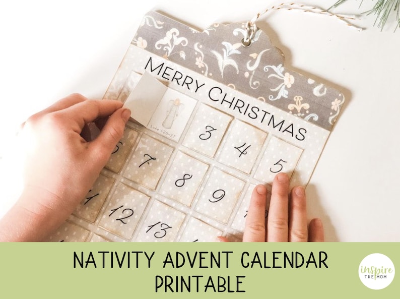 May include: A printable Nativity Advent calendar with a beige background and a floral pattern. The calendar has 25 numbered squares with a small white square behind each number. The text "Merry Christmas" is printed at the top of the calendar.