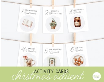 May include: Six illustrated cards with numbers 1 through 6, each with a Christmas-themed activity. The activities include reading a Christmas book together, decorating a Christmas tree, lighting a scented candle, making hot chocolate, hanging a Christmas wreath, and making sugar cookies.