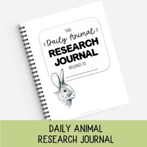 May include: A white spiral-bound journal with a black ink illustration of a rabbit on the cover. The text reads THIS Daily Animal RESEARCH JOURNAL BELONGS TO, with a line for a name. The design is clean, featuring black typography on white.
