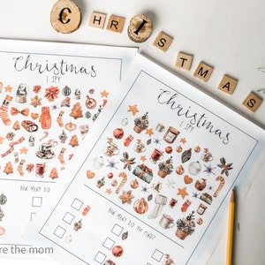 May include: Two printable Christmas I Spy activity sheets with illustrations of various Christmas-themed objects, such as baubles, stockings, candy canes, and mugs. The sheets include a section for counting how many of each object you can find.
