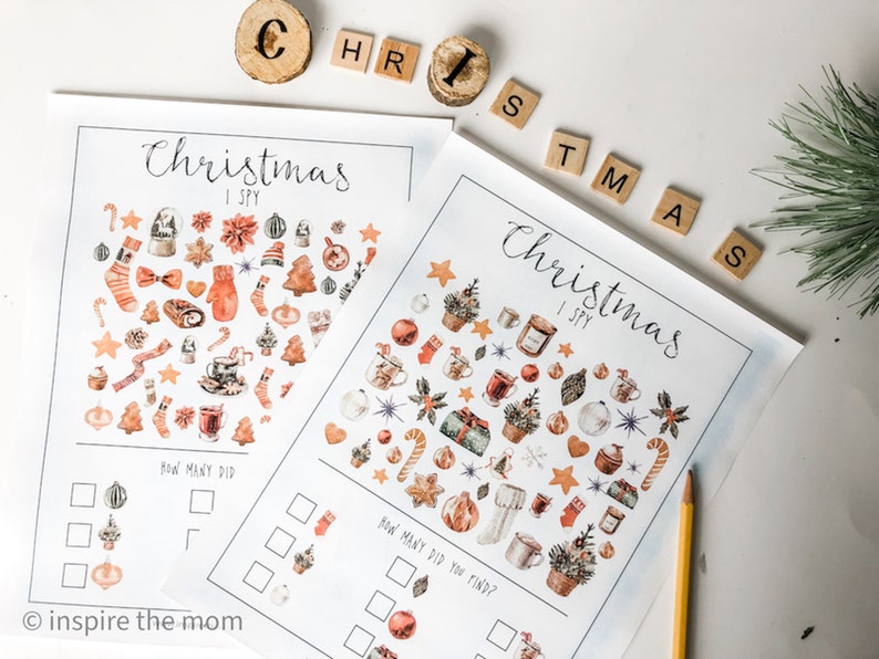 May include: Two printable Christmas I Spy activity sheets with illustrations of various Christmas-themed objects, such as baubles, stockings, candy canes, and mugs. The sheets include a section for counting how many of each object you can find.