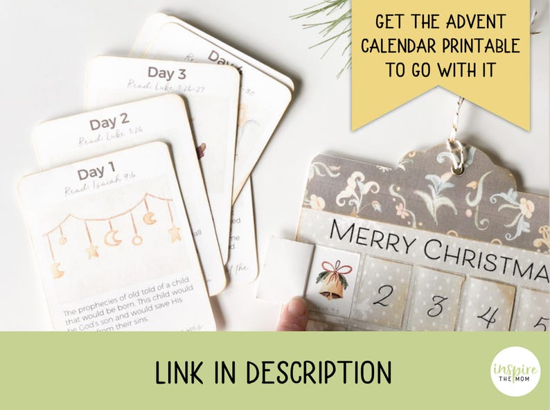 May include: Advent calendar with numbered days and a decorative design. The calendar has a "Merry Christmas" banner and includes cards with Bible verses. The image also includes the text "Get the Advent Calendar Printable to go with it" and "Link in Description."