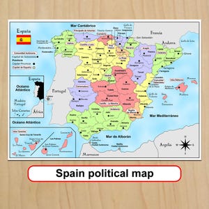 May include: A colourful political map of Spain featuring autonomous communities in distinct shades, including the Canary Islands in an inset box, the Spanish flag, a compass rose, and labels for major cities, provinces, and surrounding countries.