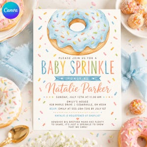 Peut inclure: Une carte d'invitation rectangulaire illustrée d'un grand beignet à l'aquarelle avec un glaçage bleu et des vermicelles colorés. Le texte indique : Please join us for a baby sprinkle honoring Natalie Parker, Sunday, July 12th at 11:30 AM, Emily's house, 428 Maple Drive, Cedarville, OH 45314.
