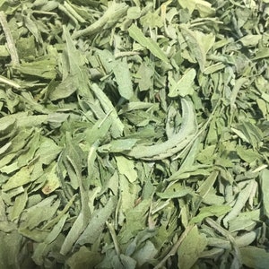 May include: Close-up of a pile of dried green leaves. The leaves are a light green color and have a slightly rough texture.