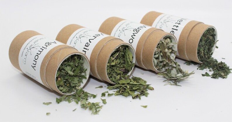May include: Four cardboard tubes filled with dried herbs, labeled "Harmony", "Everair", "Mugwort", and "Nettle".