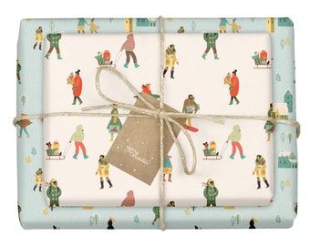 Può includere: Una carta da regalo bianca con un bordo blu presenta un motivo ripetitivo di persone che portano regali e vanno in slitta. La carta da regalo è legata con uno spago e un cartellino regalo marrone su cui è scritto "buon natale".
