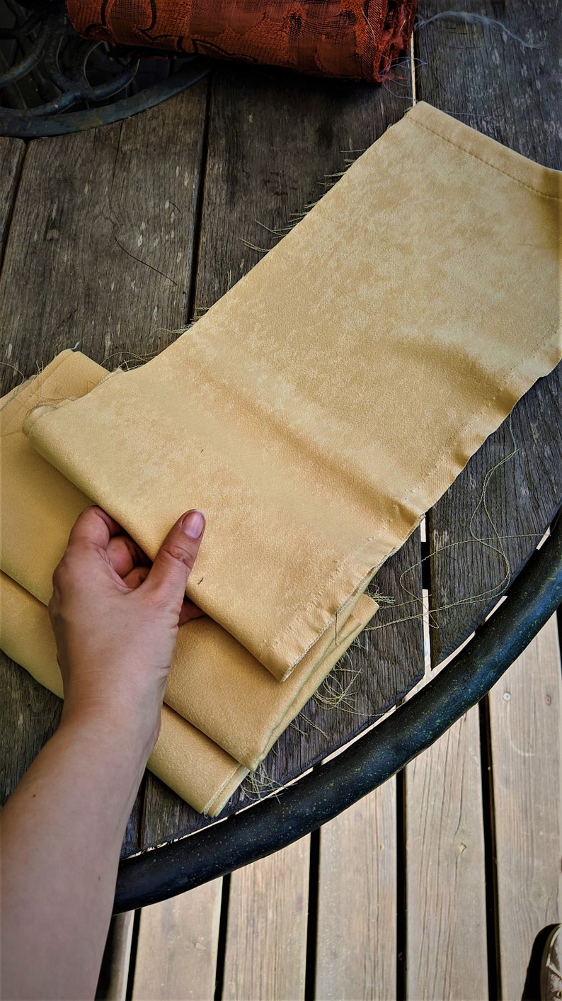 Light yellow fabric cutting curtains waste remains sewing scraps supply handcrafts textile soft