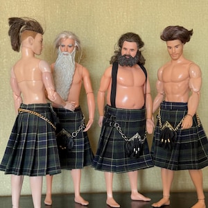 May include: Four male dolls standing in a row, each wearing a green and navy blue plaid kilt with a black sporran and a silver chain. The dolls have varied hairstyles and facial hair, including a long white beard and a dark brown full beard.