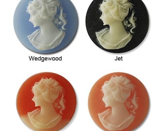 May include: Four cameo buttons in different colors: Wedgewood blue, jet black, carnelian orange, and angel skin pink. Each button features a white cameo of a woman's profile.