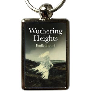 May include: A rectangular keychain with a silver metal frame. The insert displays the book cover of "Wuthering Heights" by Emily Brontë, showing a ghostly figure in a landscape. The keychain has a silver ring.