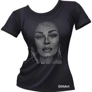 May include: Black t-shirt with a silver rhinestone design of a woman's face. The design is in a pixelated style. The text "GlitArt" is printed on the bottom of the shirt.