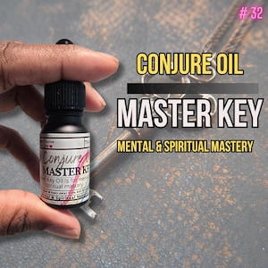 May include: A black bottle of "Conjure Oil Master Key" is held in a hand. The label reads "Key Oil is for mental & spiritual mastery." The background features a key and the text "Mental & Spiritual Mastery."
