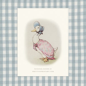 May include: A watercolour illustration of a duck wearing a pink dress and a blue bonnet. The duck is standing on a white background. The text "Exclusively Available At PRETTYINPRINTART.COM" is at the bottom of the image.
