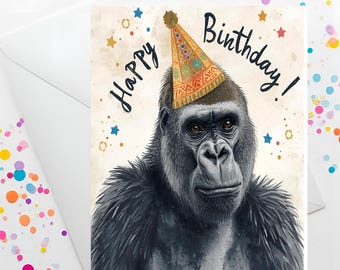 May include: A birthday greeting card featuring a gorilla wearing a party hat. The card has the words "Happy Birthday!" written in black script. The background is a light beige with scattered stars and confetti.