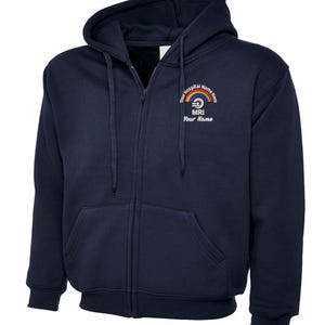 May include: Navy blue zip-up hoodie with a hood and front pockets. The left chest features a rainbow design with the text "Your Hospital Name Here", "MRI", and "Your Name". The hoodie has drawstrings and ribbed cuffs.