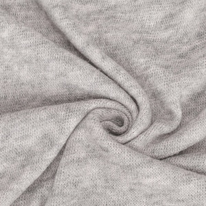 May include: Close-up of a soft, grey fabric with a textured knit pattern. The fabric is folded and draped, showcasing its texture and drape.