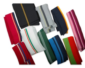 May include: Assortment of striped knit fabric trim in various colors, including red, white, green, blue, black, grey, pink, and orange. The trim is ideal for adding a decorative touch to clothing, crafts, and home decor projects.