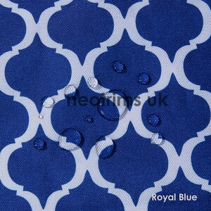 May include: Royal blue fabric with a white quatrefoil pattern. The fabric has water droplets on the surface. The text "heorins uk" and "Royal Blue" are visible on the fabric.