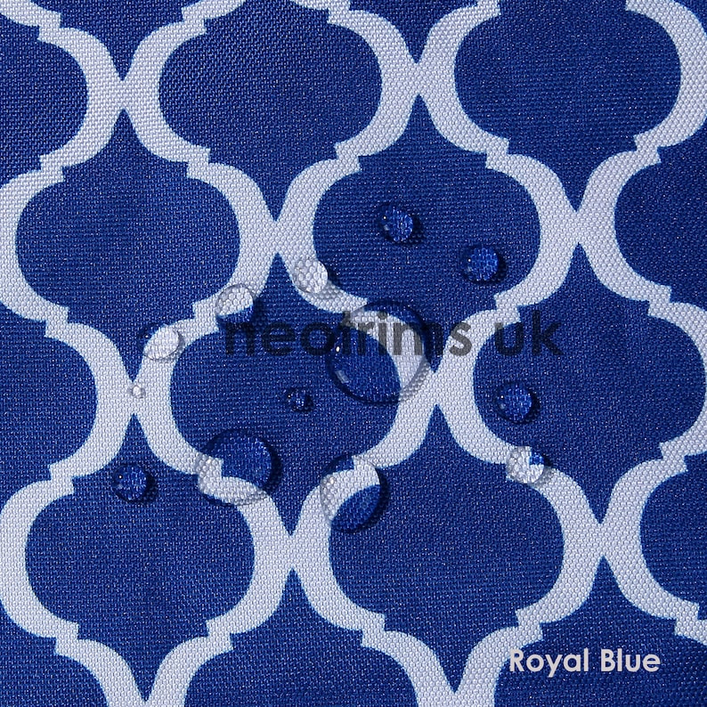 May include: Royal blue fabric with a white quatrefoil pattern. The fabric has water droplets on the surface. The text "heorins uk" and "Royal Blue" are visible on the fabric.