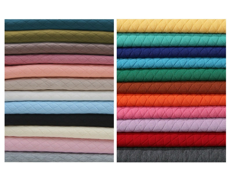 May include: A stack of 18 different colored fabric swatches. The fabric has a quilted diamond pattern. The colors include green, pink, beige, blue, black, white, red, orange, brown, and gray.