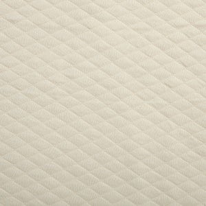 May include: Close-up of a cream-colored quilted fabric. The fabric has a repeating diamond pattern, creating a textured surface. The material appears soft and is likely used for bedding or upholstery.