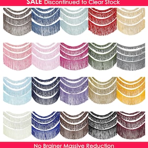 May include: A collection of decorative fringe trim in various colors, including brown, blue, red, and pink. The trim is arranged in rows, with each row showcasing a different color. The image includes the text "SALE Discontinued to Clear Stock" and "No Brainer Massive Reduction".