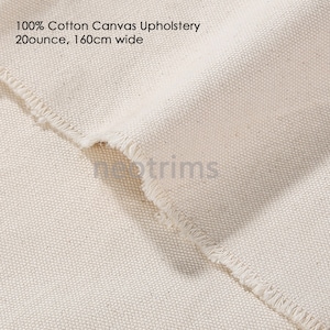 May include: Close-up of a natural off-white cotton canvas fabric with a raw edge. 100% Cotton Canvas Upholstery 20 ounce, 160cm wide.