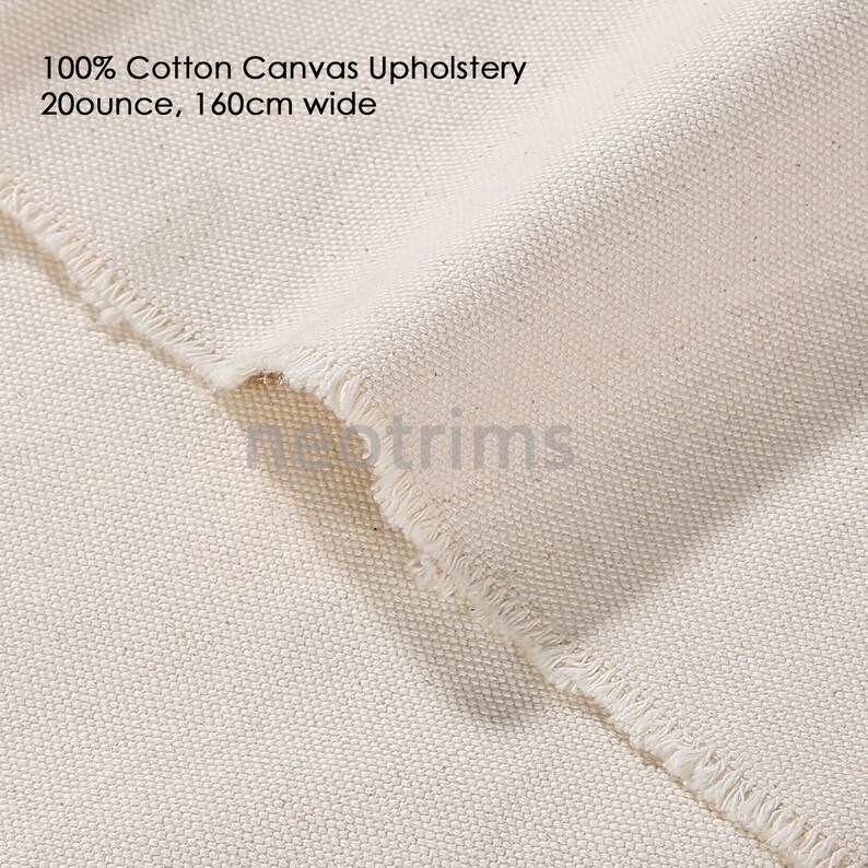 May include: Close-up of a natural off-white cotton canvas fabric with a raw edge. 100% Cotton Canvas Upholstery 20 ounce, 160cm wide.
