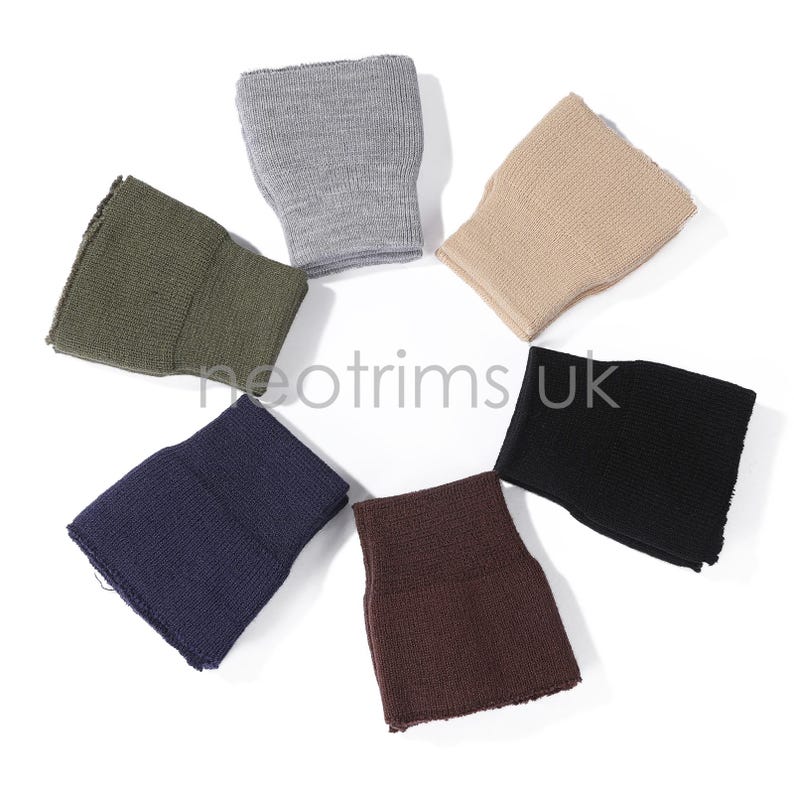 May include: A collection of six wristbands in various colors, including olive green, gray, tan, black, navy blue, and brown. The wristbands are made of a knitted material and are arranged in a circular pattern. The text "neotrims UK" is visible.