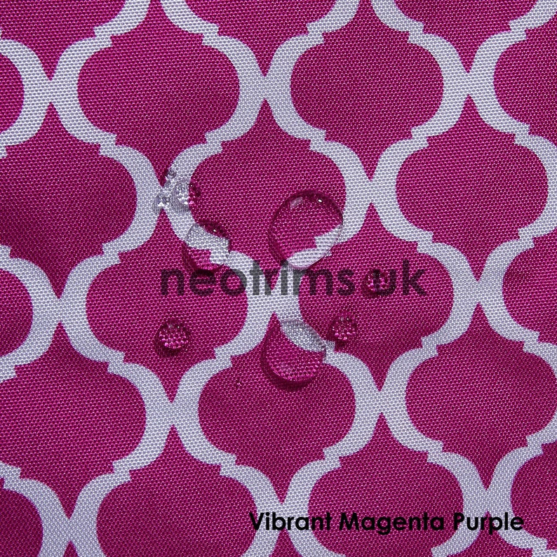 May include: Close-up of a vibrant magenta purple fabric with a white quatrefoil pattern. The fabric has a water-resistant finish, with several water droplets visible on the surface. The text "neotrimsuk" and "Vibrant Magenta Purple" are also visible.