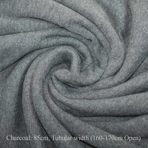 May include: Charcoal gray fabric with a tubular width of 160-170 cm open. The fabric is 85 cm wide.