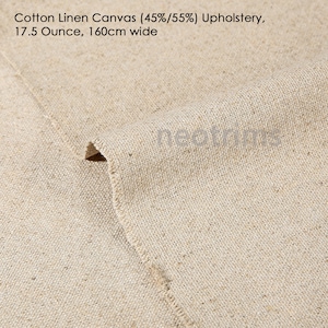 May include: Close-up of a natural beige cotton linen canvas fabric. The fabric is woven with a tight weave and has a slightly textured surface. The fabric is 45% cotton and 55% linen. It weighs 17.5 ounces per yard and is 160 centimeters wide.