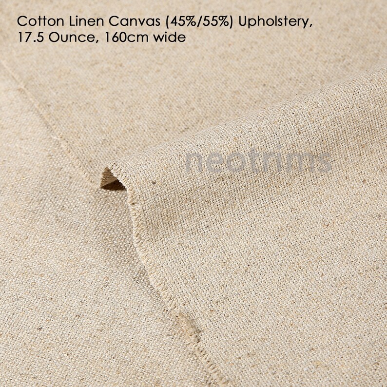 May include: Close-up of a natural beige cotton linen canvas fabric. The fabric is woven with a tight weave and has a slightly textured surface. The fabric is 45% cotton and 55% linen. It weighs 17.5 ounces per yard and is 160 centimeters wide.