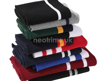 May include: A stack of different colored knit fabric trim with white stripes. The trim is folded and stacked in a pile. The trim is used for clothing and other crafts.