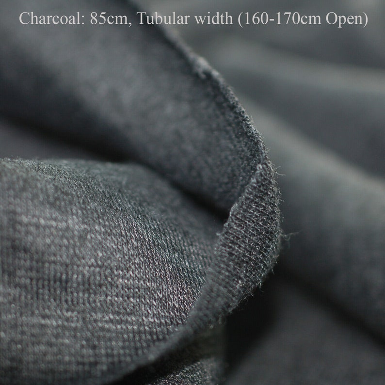 May include: Close-up of charcoal gray fabric with a tubular width of 160-170cm open. The fabric is soft and textured.